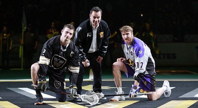 Tewanee Joseph, Brett Mydske and Brodie Merrill pose during a ceremonial ball drop on First Nations Celebration Night in the 2021-22 NLL Season.